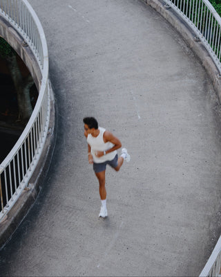 Man running on walkway in urban setting